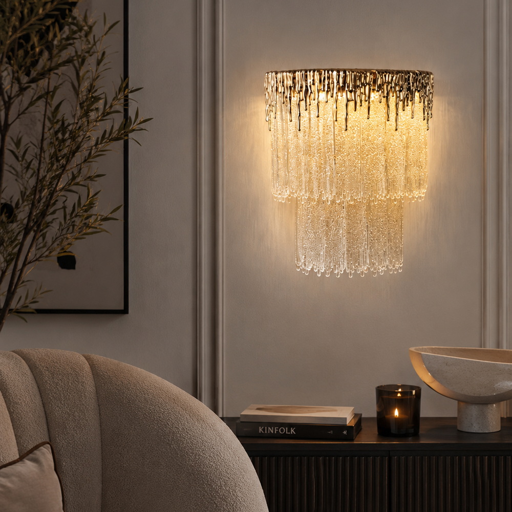Gold LED sconce with a sugar glass pendant